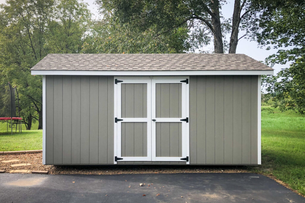 Sheds near Nashville, TN: Gray/ brown Lancaster shed with white trim.