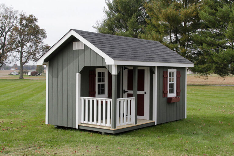Sheds near Gallatin TN: Gray/green cottage playhouses with white & red trim.