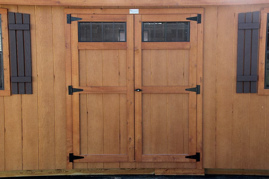 wooden double doors on a shed window