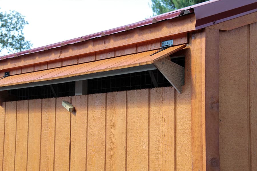 wooden chicken coop with a vent